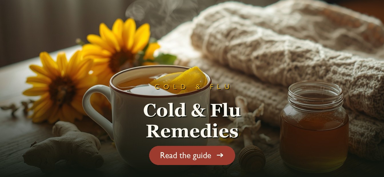 A steaming mug of echinacea and ginger cold remedy tea with honey and lemon